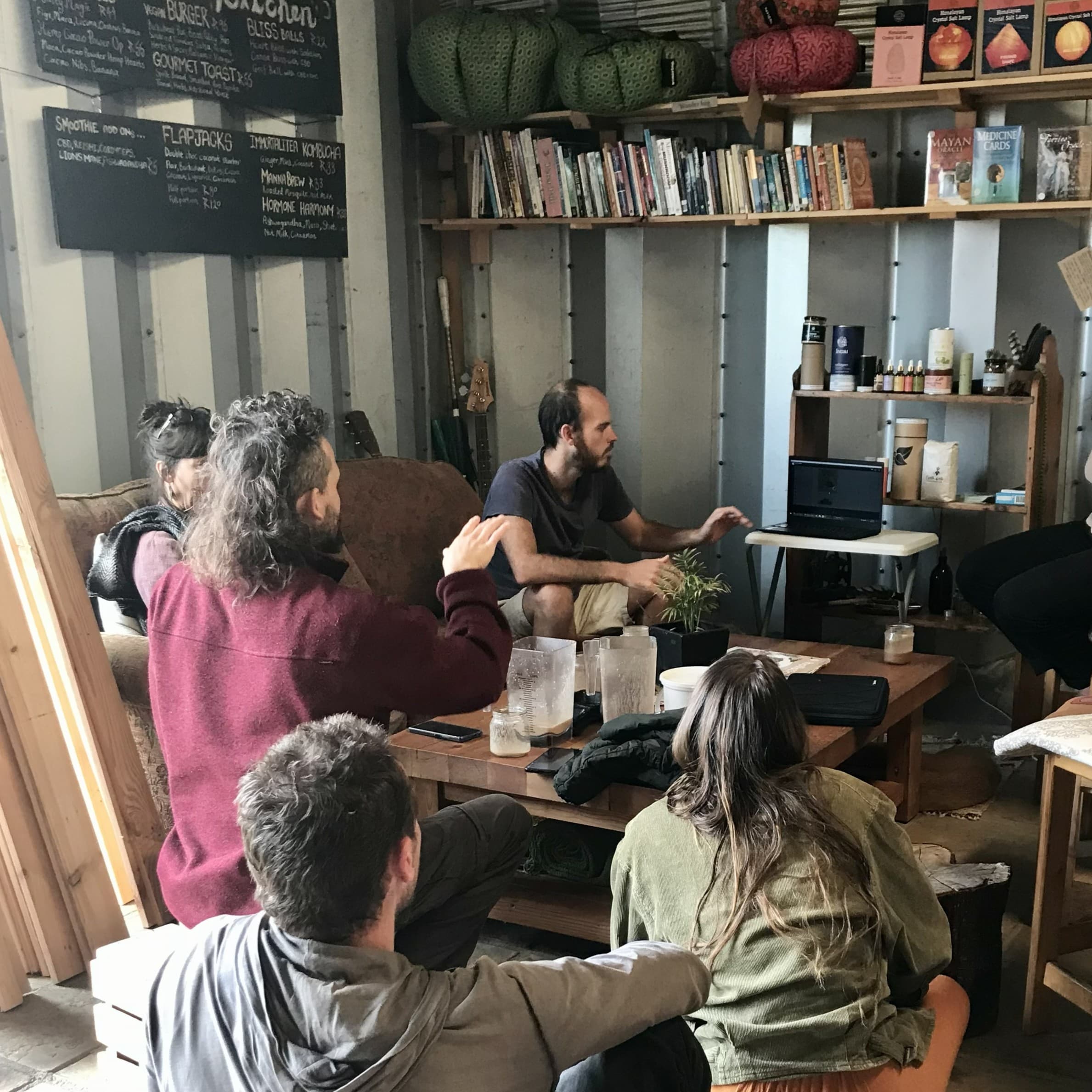 The early Cosmic Bazaar crew gathered in the shop.