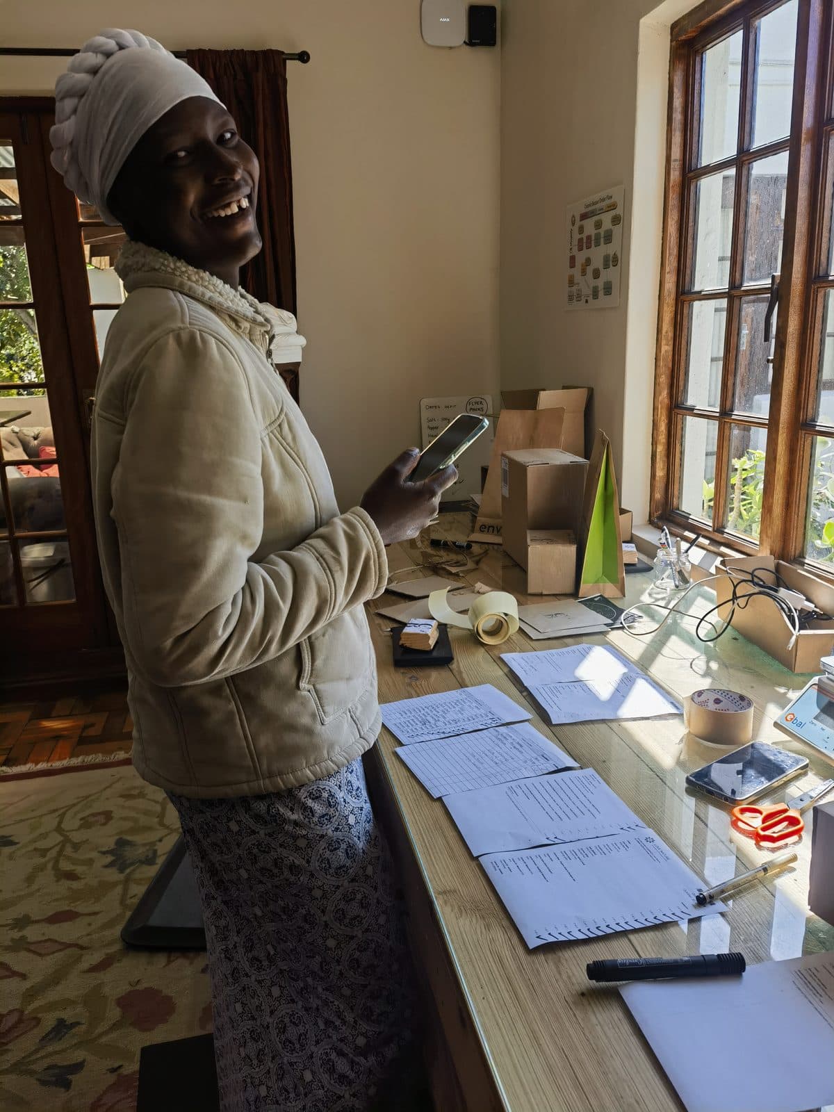Packing an order at the sunlit depot counter.